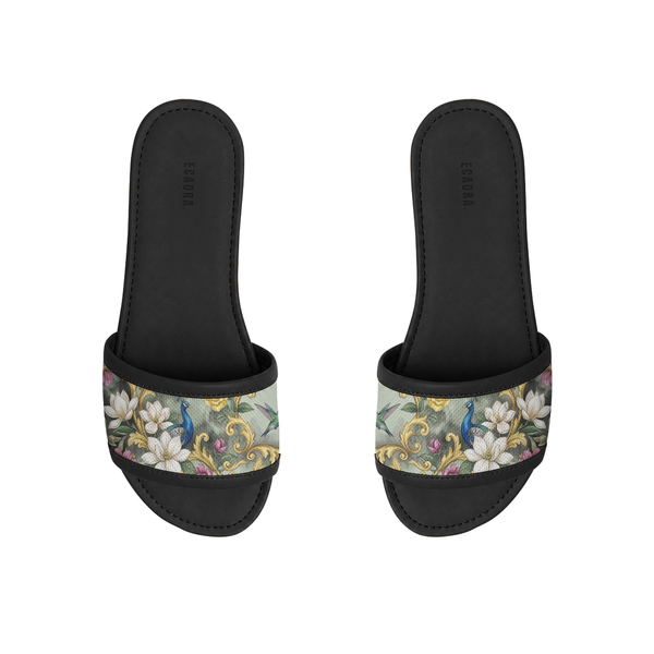 Pair of ECADRA Black Drift Slides with a canvas strap featuring a majestic peacock, hummingbird, and baroque floral print.
