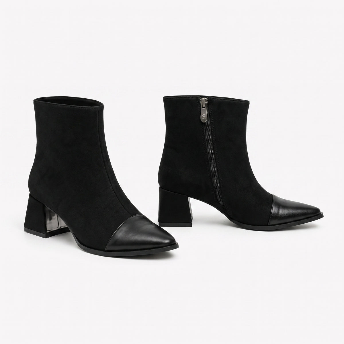 Black suede signature cap-toe ankle boots with sturdy block heel and metallic zipper detail.