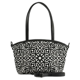 Wide tote bag with black and white geometric Moroccan-style pattern, black leather trim