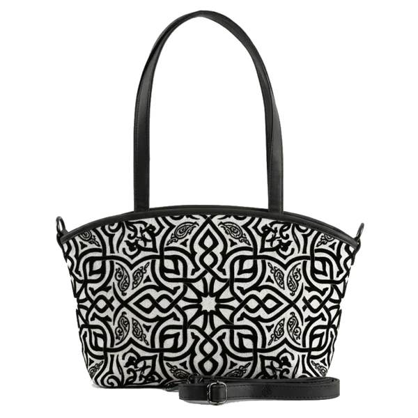 Wide tote bag with black and white geometric Moroccan-style pattern, black leather trim