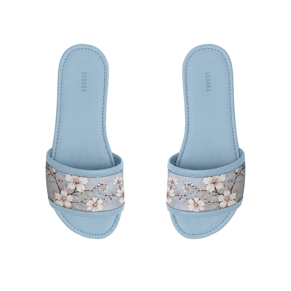 Pair of light blue ECADRA Blue Drift Slides featuring a canvas strap with a delicate white cherry blossom branch print.