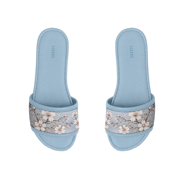 Pair of light blue ECADRA Blue Drift Slides featuring a canvas strap with a delicate white cherry blossom branch print.