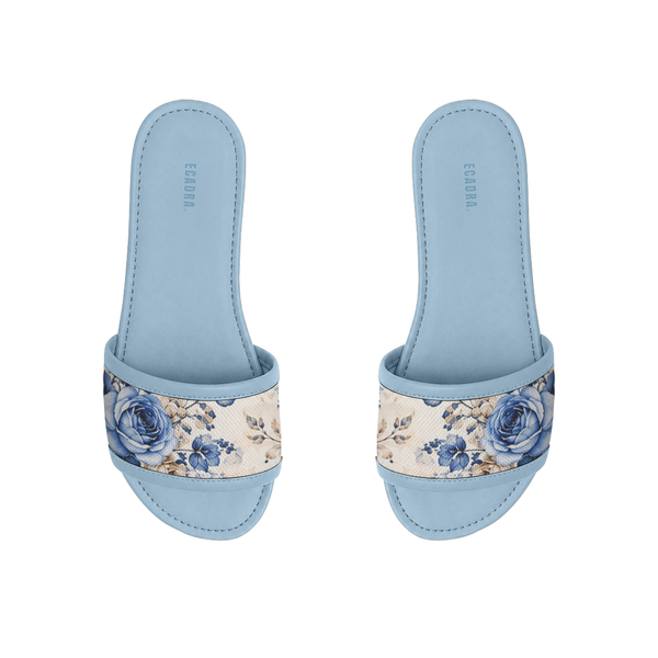 Pair of light blue ECADRA Blue Drift Slides featuring a canvas strap with a vintage blue rose and botanical floral print.
