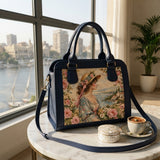 ECADRA navy travel hobo bag with vintage regency woman illustration, on marble table overlooking Nile river with Egyptian coffee