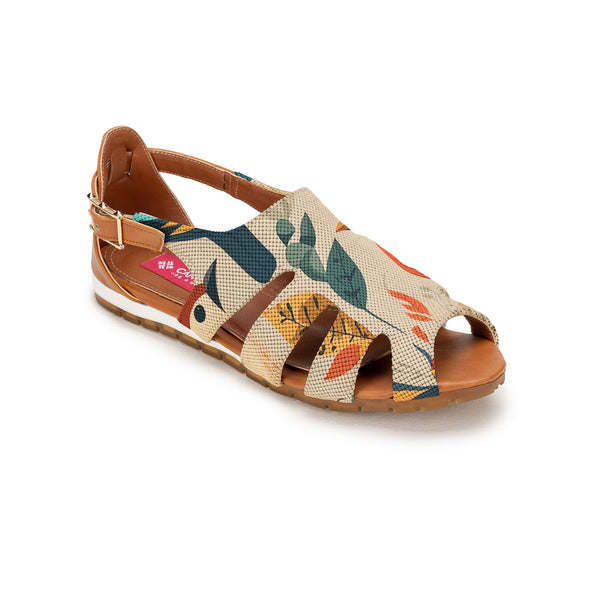 A single women's flat sandal with a beige woven canvas upper featuring a colorful botanical leaf pattern in green, orange, and blue, with brown leather straps and a white midsole. | ECADRA