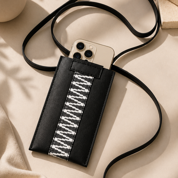 Phone case with a strap on a beige surface. ECADRA 