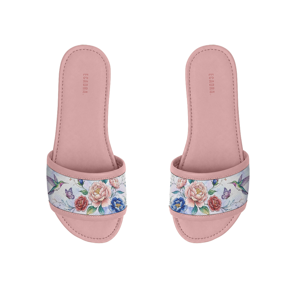 Pair of pink ECADRA Rose Drift Slides featuring a canvas strap with a vibrant hummingbird, butterfly, and floral print.