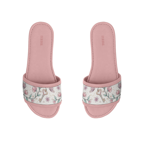 Pair of pink ECADRA Rose Drift Slides with a canvas strap featuring a vintage floral, butterfly, and heart key print.