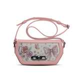 Pink ECADRA Rose Swag Crossbody Bag featuring a canvas front with a lilac bow, vintage roses, and a secure turn-lock.