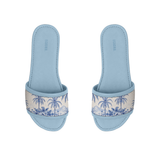 Pair of light blue ECADRA Blue Drift Slides featuring a canvas strap with a coastal blue tropical palm tree toile print.