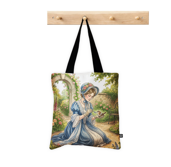 ECADRA handmade canvas tote bag featuring a vintage cottagecore illustration of a lady feeding a bird in a garden.