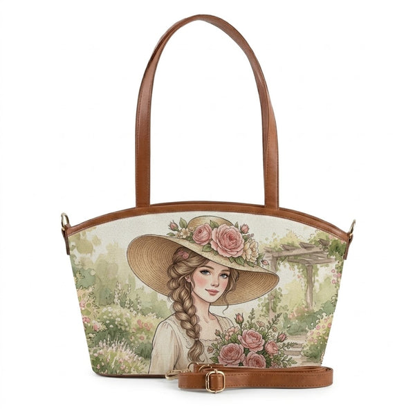 A canvas tote bag featuring a watercolor artwork of a woman wearing a wide-brimmed straw hat with pink roses, set against a garden background, accented with brown faux leather straps.