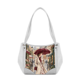 White hobo shoulder bag featuring printed vintage artwork of an elegant woman with an umbrella on a rainy Paris street.