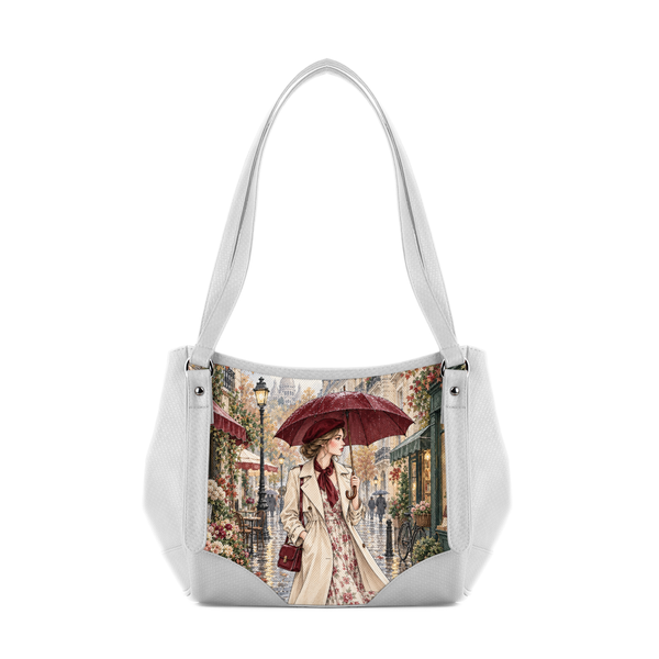 White hobo shoulder bag featuring printed vintage artwork of an elegant woman with an umbrella on a rainy Paris street.