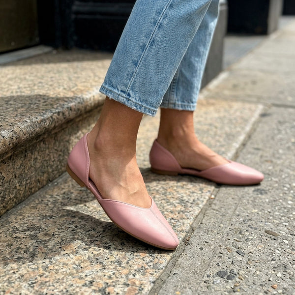 Close-up of rose open-side d'Orsay Wink Flats worn with cropped jeans on a sidewalk | ECADRA