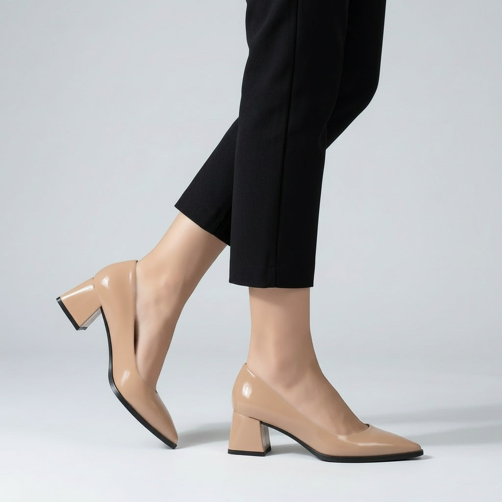 Woman walking in beige gloss pointed pumps with low 5 cm flared block heel, side view — ECADRA