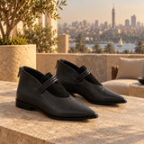Black on Black pointed-toe ankle boots with three coiled straps — pair on a Zamalek rooftop — ECADRA