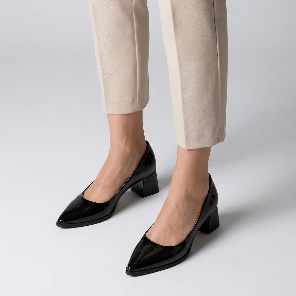 Woman wearing black gloss pointed pumps with low 5 cm flared block heel, front view — ECADRA