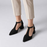 Black suede T-strap heels with wide strap, silver buckle and 5 cm flared heel, worn on model, front — ECADRA