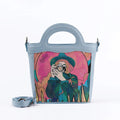 Blue Top Handle Handbag The space photographer