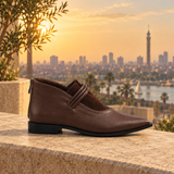 Brown pointed-toe ankle boots with three coiled straps — three-quarter view — ECADRA