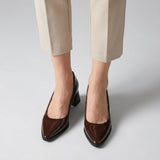 Woman wearing brown gloss pointed pumps with low 5 cm flared block heel, front view — ECADRA