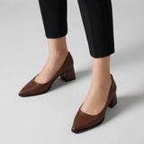 Woman wearing brown matte pointed pumps with low 5 cm flared block heel, front view — ECADRA