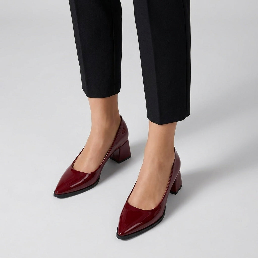 Woman wearing burgundy gloss pointed pumps with low 5 cm flared block heel, front view — ECADRA