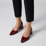 Woman wearing burgundy gloss pointed pumps with low 5 cm flared block heel, front view — ECADRA