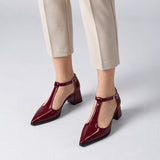 Burgundy gloss T-strap heels with wide strap, silver buckle and 5 cm flared heel, worn on model, front — ECADRA