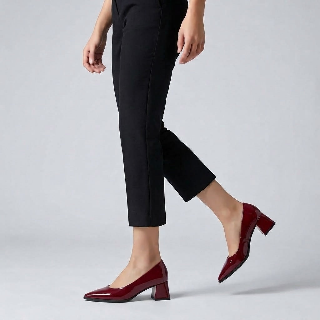 Woman walking in burgundy gloss pointed pumps with low 5 cm flared block heel, side view — ECADRA