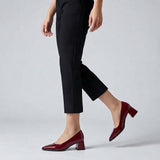 Woman walking in burgundy gloss pointed pumps with low 5 cm flared block heel, side view — ECADRA