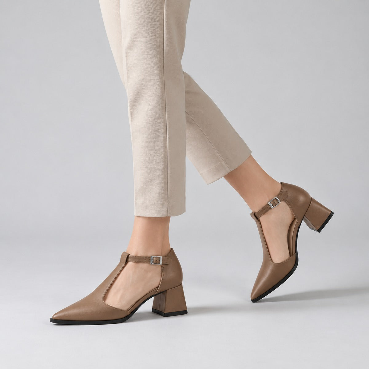 Café matte T-strap heels with wide strap, silver buckle and 5 cm flared heel, worn on model, walking — ECADRA