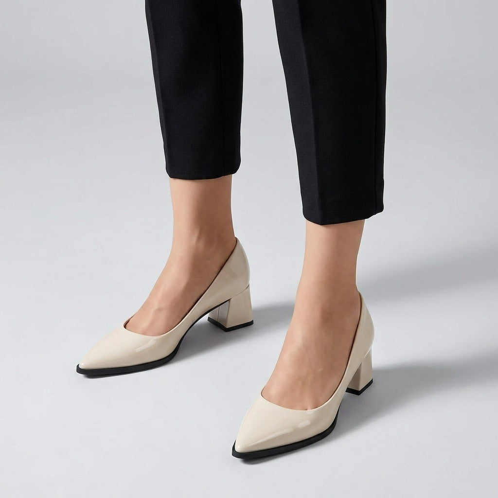 Woman wearing cream gloss pointed pumps with low 5 cm flared block heel, front view — ECADRA