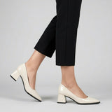 Woman walking in cream gloss pointed pumps with low 5 cm flared block heel, side view — ECADRA