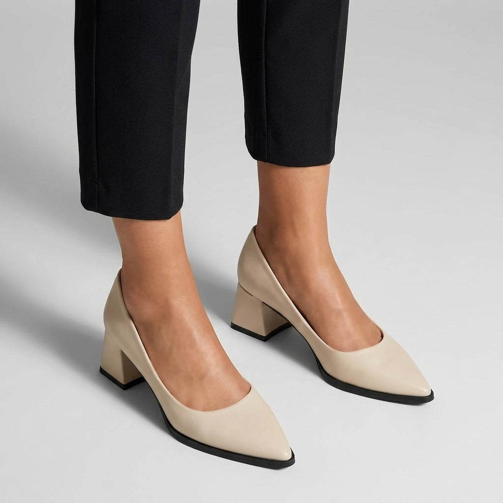 Woman wearing cream matte pointed pumps with low 5 cm flared block heel, front view — ECADRA