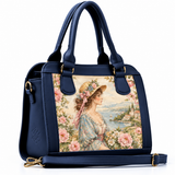 Navy leather hobo bag with vintage regency woman illustration and floral panel, product shot on white background
