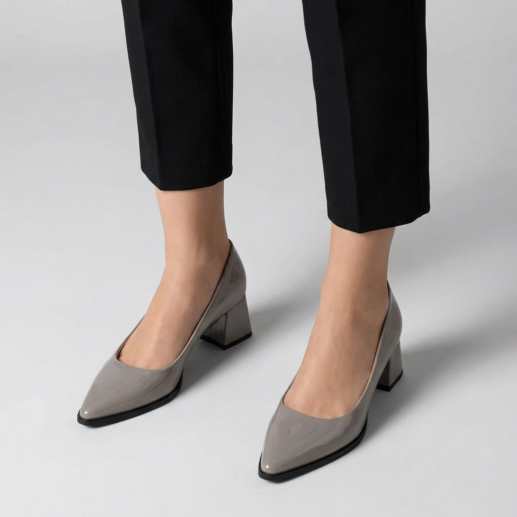 Woman wearing grey gloss pointed pumps with low 5 cm flared block heel, front view — ECADRA