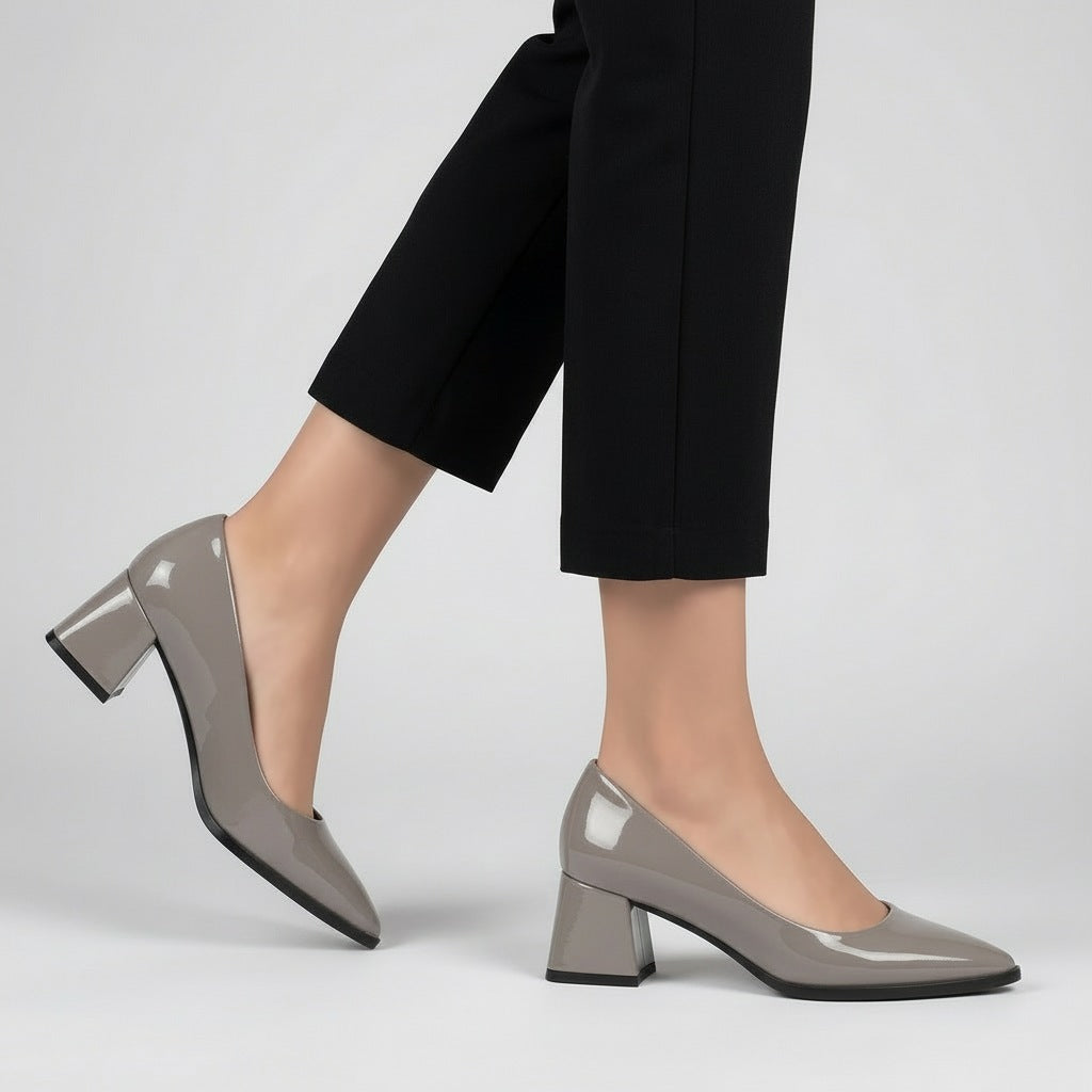 Woman walking in grey gloss pointed pumps with low 5 cm flared block heel, side view — ECADRA