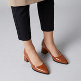 Woman wearing havana gloss pointed pumps with low 5 cm flared block heel, front view — ECADRA