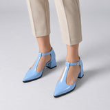 Light Blue gloss T-strap heels with wide strap, silver buckle and 5 cm flared heel, worn on model, front — ECADRA