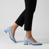 Woman walking in light blue gloss pointed pumps with low 5 cm flared block heel, side view — ECADRA