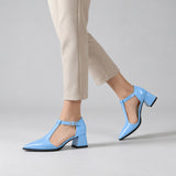 Light Blue gloss T-strap heels with wide strap, silver buckle and 5 cm flared heel, worn on model, walking — ECADRA