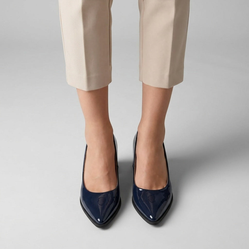 Woman wearing navy gloss pointed pumps with low 5 cm flared block heel, front view — ECADRA