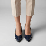 Woman wearing navy gloss pointed pumps with low 5 cm flared block heel, front view — ECADRA