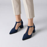 Navy suede T-strap heels with wide strap, silver buckle and 5 cm flared heel, worn on model, front — ECADRA
