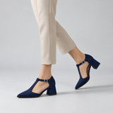 Navy suede T-strap heels with wide strap, silver buckle and 5 cm flared heel, worn on model, walking — ECADRA