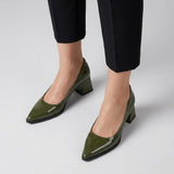 Woman wearing olive gloss pointed pumps with low 5 cm flared block heel, front view — ECADRA