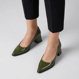 Woman wearing olive gloss pointed pumps with low 5 cm flared block heel, front view — ECADRA