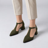 Olive suede T-strap heels with wide strap, silver buckle and 5 cm flared heel, worn on model, front — ECADRA